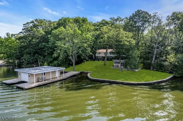a view of a table and chairs in backyard of the house