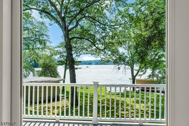 a view of a wooden fence and trees
