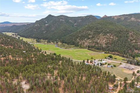 a view of a tree with a yard