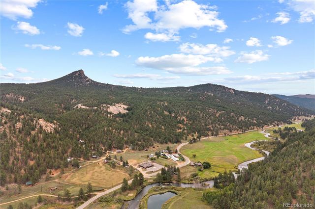 a view of a city with mountains in the background