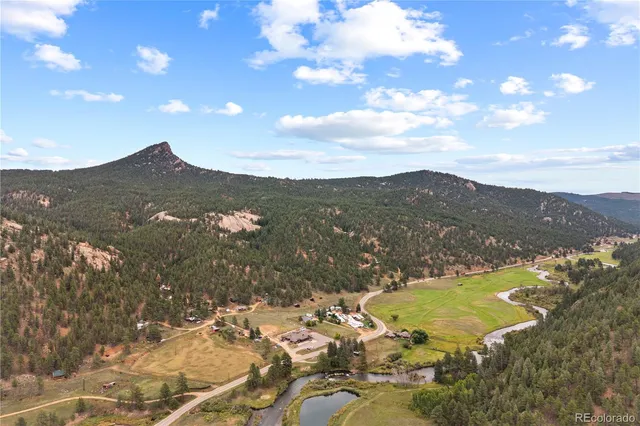 a view of a city with mountains in the background