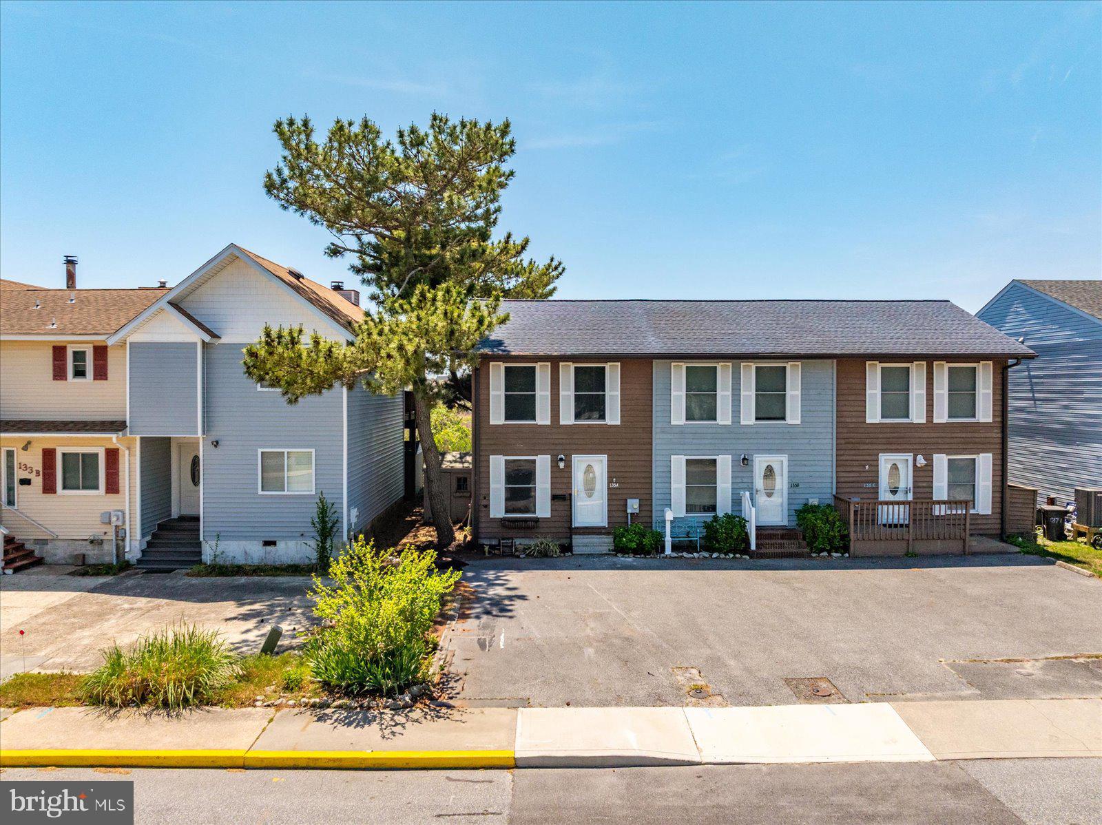 135 Jamestown Road, Unit 18A Ocean City, MD 21842 - Photo 1 of 63 a front view of a residential houses with yard