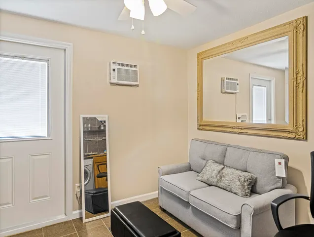 a living room with furniture and a window