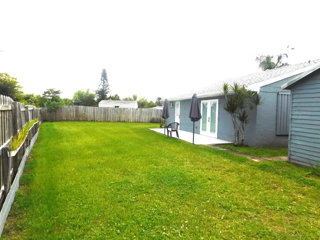 a view of a backyard with a garden and plants