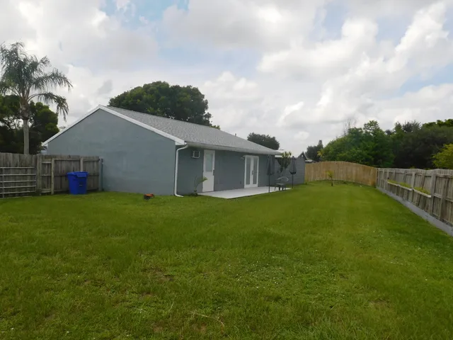 a backyard of a house with lots of green space
