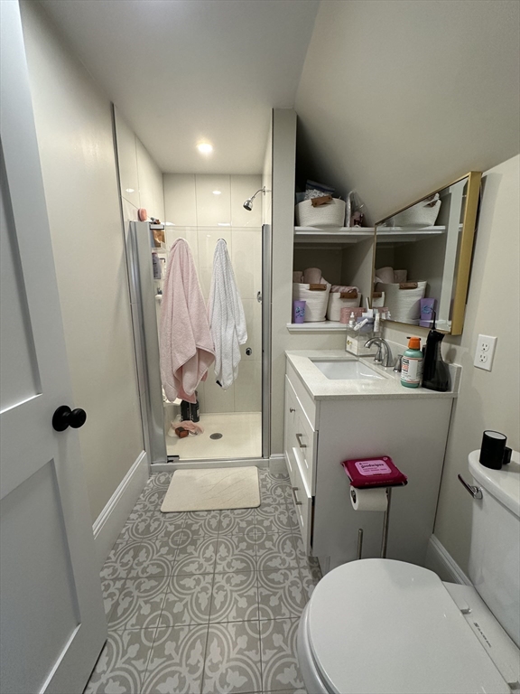 304 Main Street, Unit 2 Winthrop, MA 02152 - Photo 4 of 9 a bathroom with a sink toilet and shower
