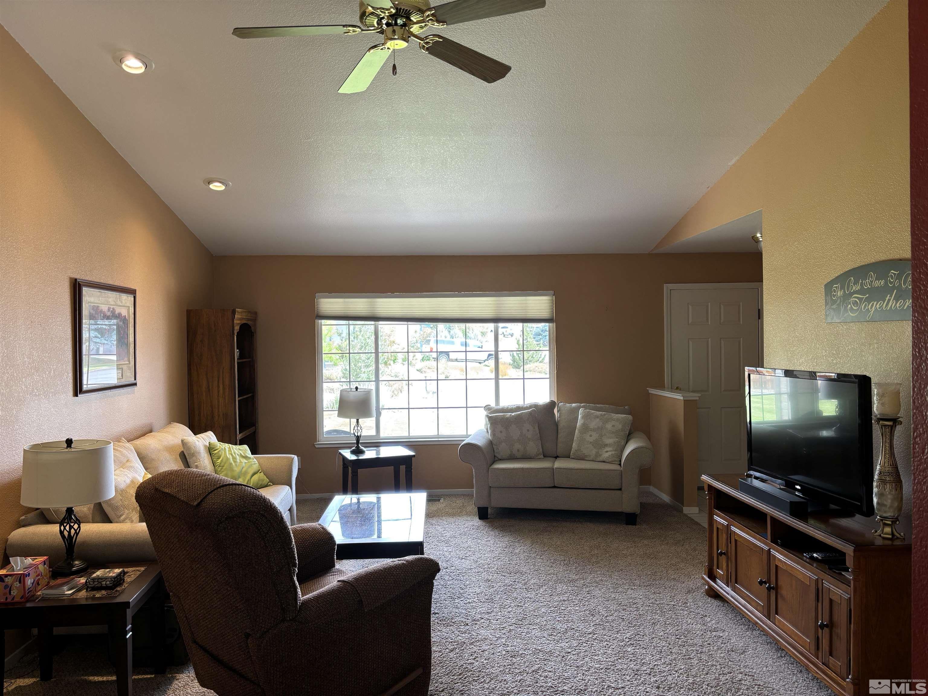 20 Ghost Rider Court Reno, NV 89511 - Photo 3 of 18 a living room with furniture and a flat screen tv