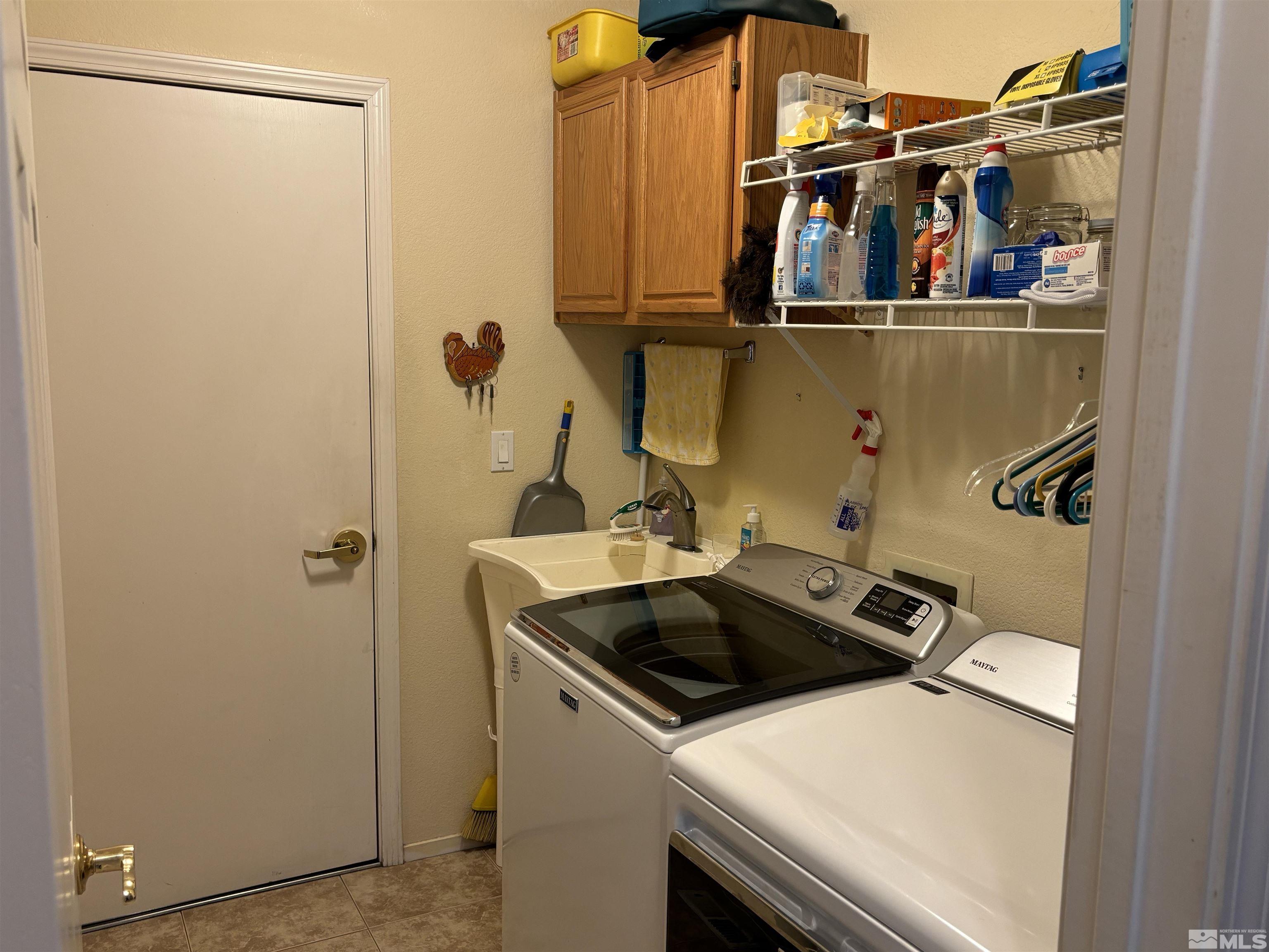 20 Ghost Rider Court Reno, NV 89511 - Photo 8 of 18 a utility room with dryer and washer