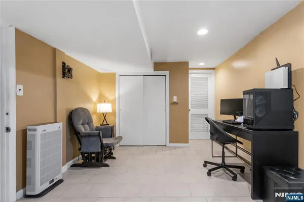 a view of workspace with wooden floor windows