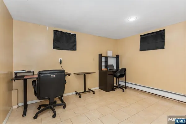 a view of a workspace with furniture