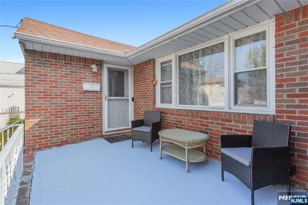 a outdoor living space with furniture and a window