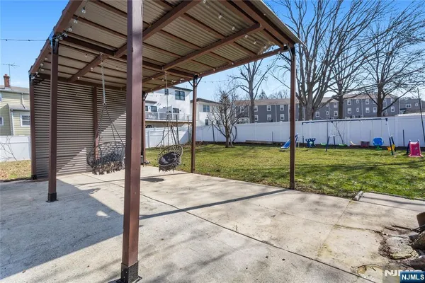 a view of a backyard with a small cabin