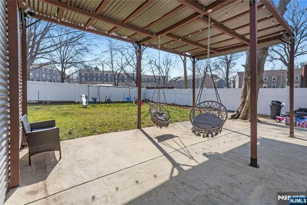 a view of a backyard with sitting area