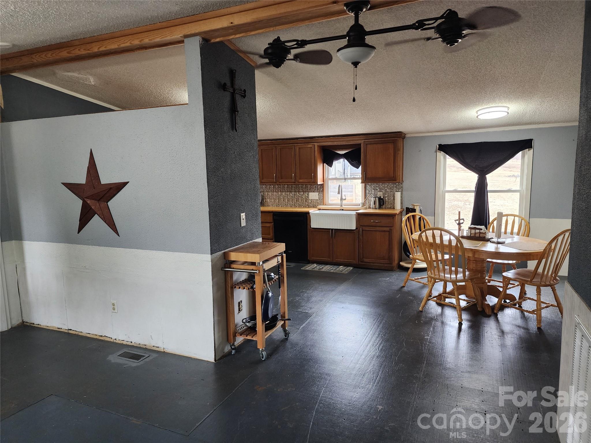 303 Johnson Dairy Road Mooresville, NC 28115 - Photo 14 of 36 a dining room with furniture and wooden floor
