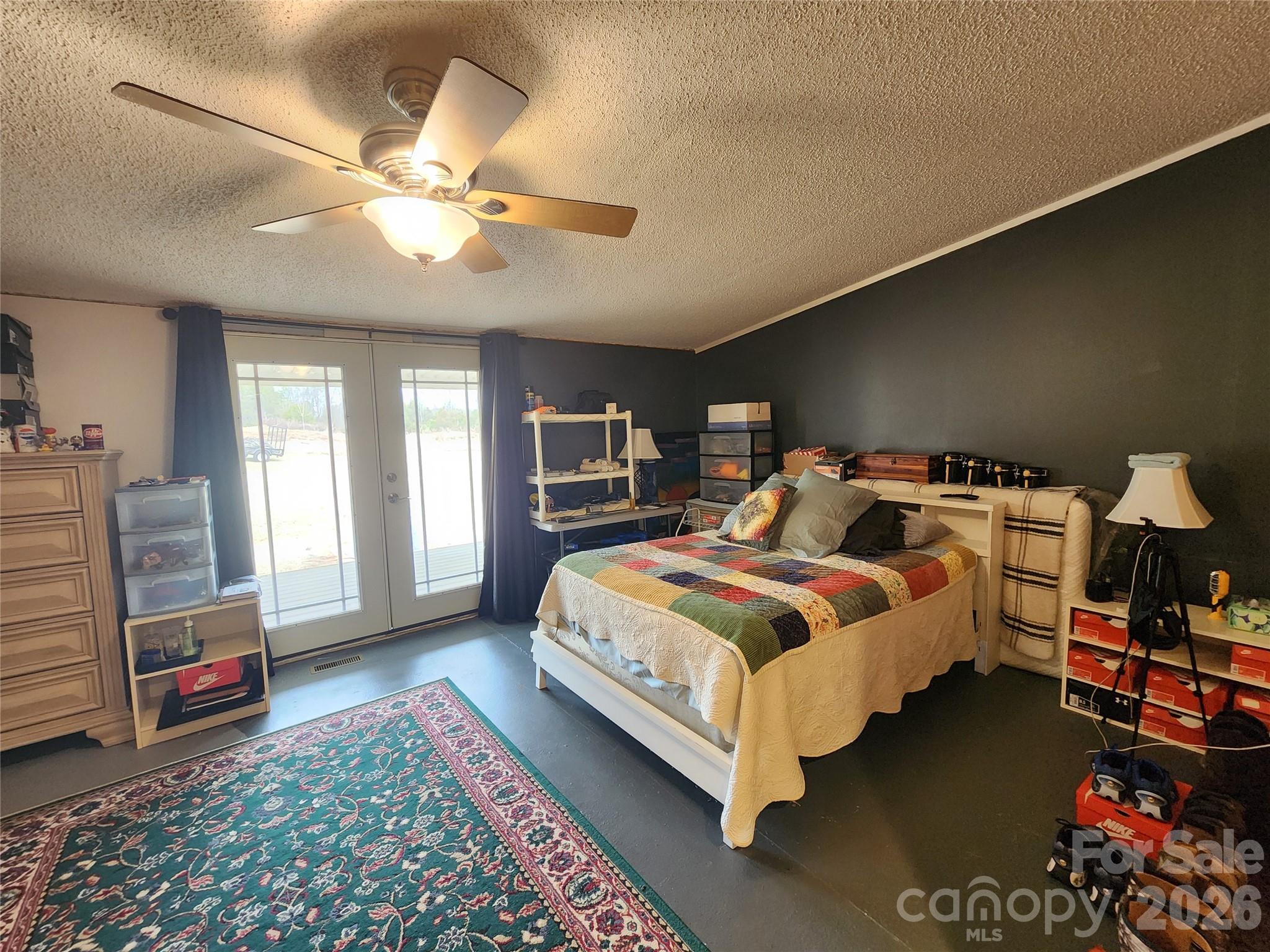303 Johnson Dairy Road Mooresville, NC 28115 - Photo 18 of 36 a bedroom with bed and window
