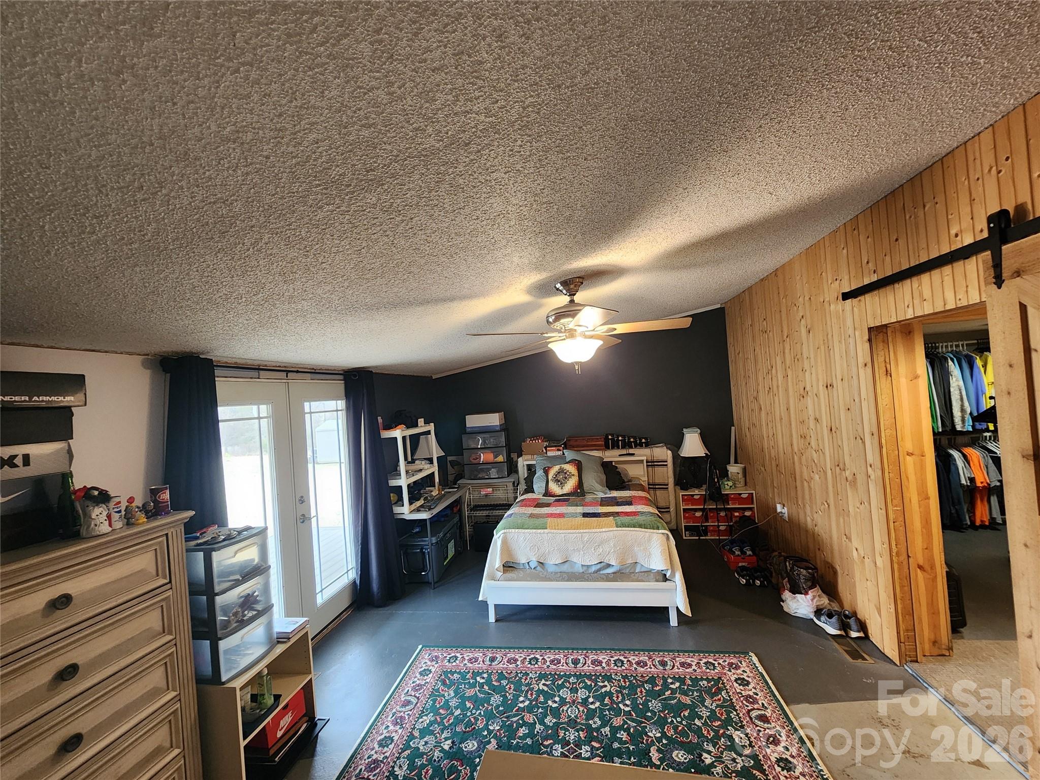 303 Johnson Dairy Road Mooresville, NC 28115 - Photo 19 of 36 a bed room with furniture and a rug