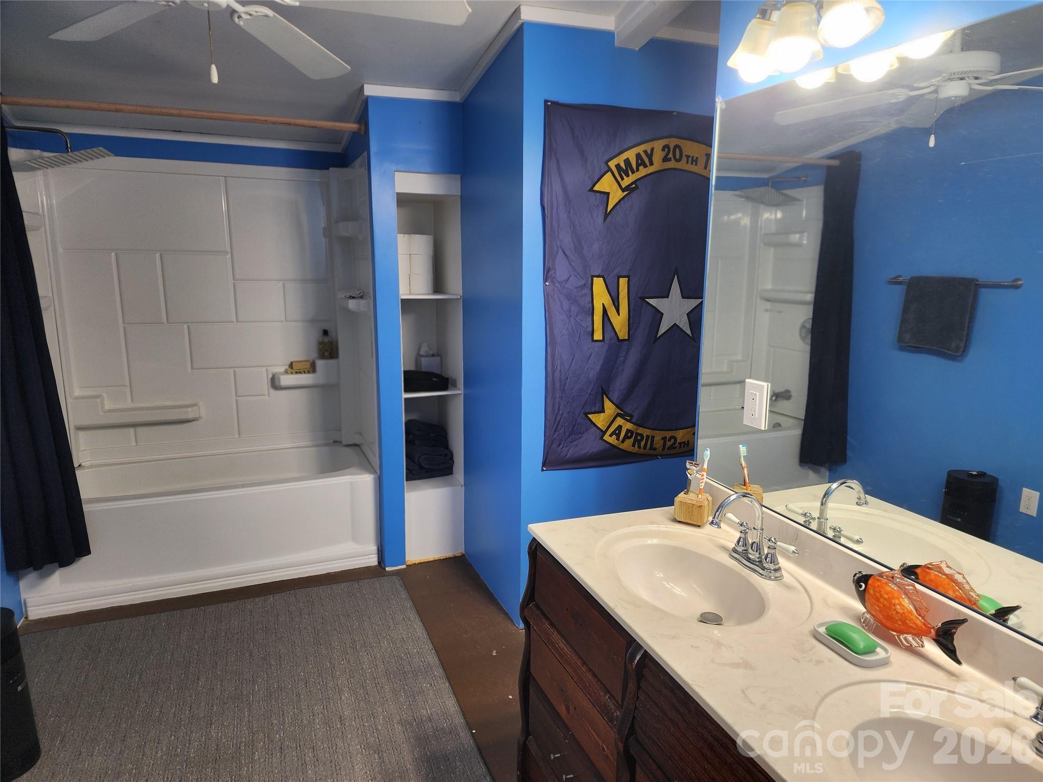 303 Johnson Dairy Road Mooresville, NC 28115 - Photo 30 of 36 a bathroom with a sink and a mirror