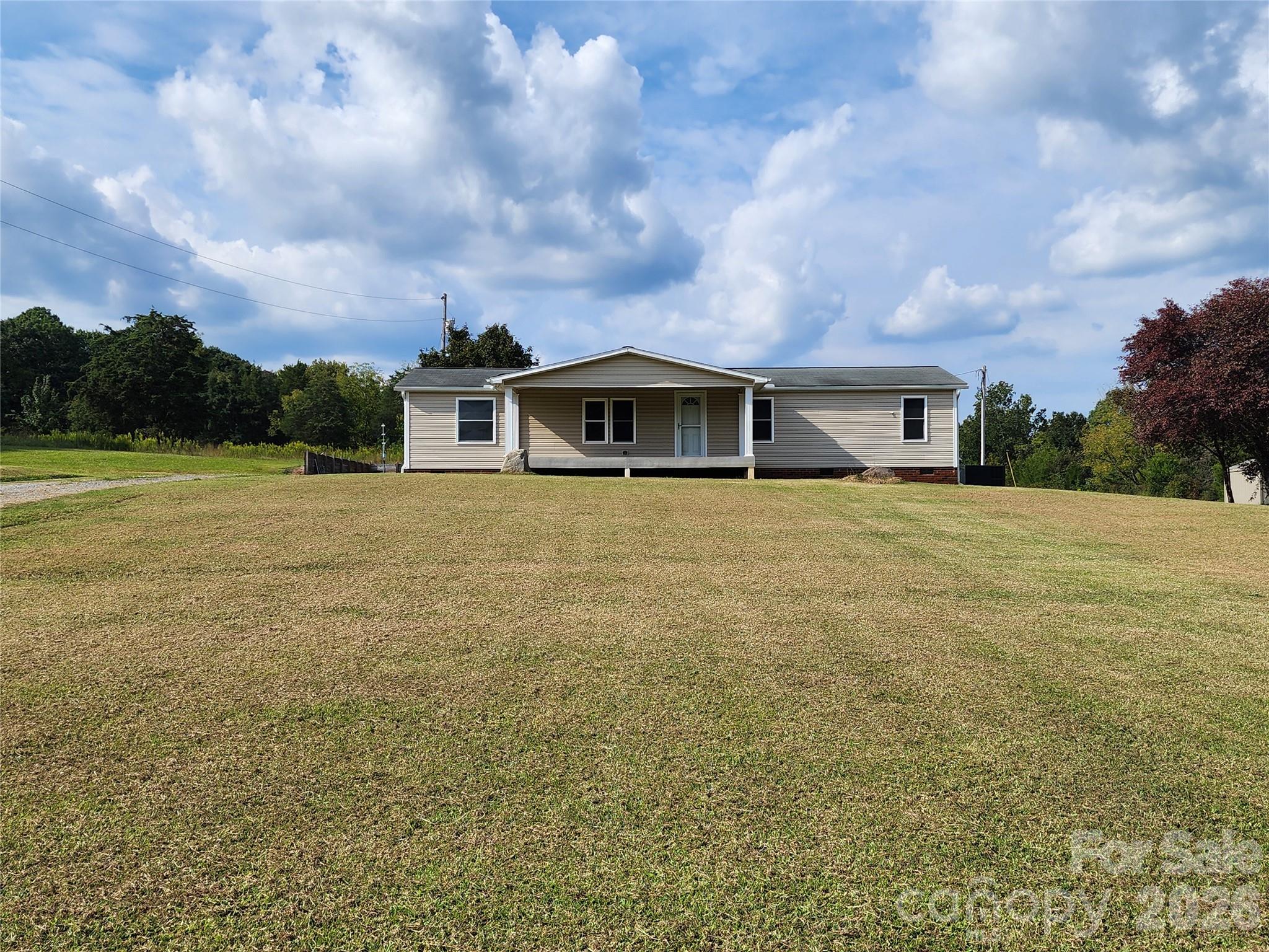 303 Johnson Dairy Road Mooresville, NC 28115 - Photo 3 of 36 a view of a house with a garden