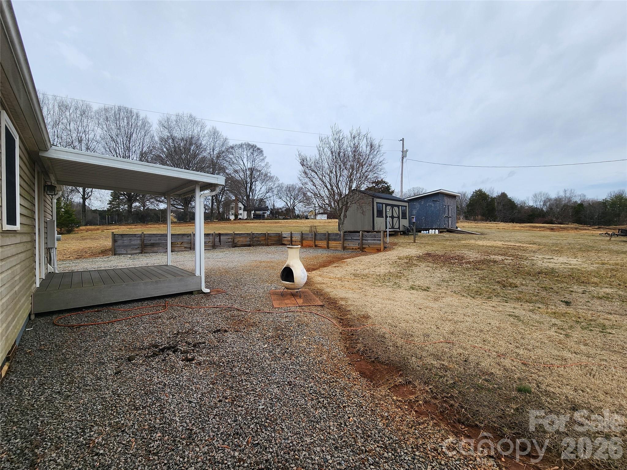 303 Johnson Dairy Road Mooresville, NC 28115 - Photo 33 of 36 a view of a outdoor space with trees in the background