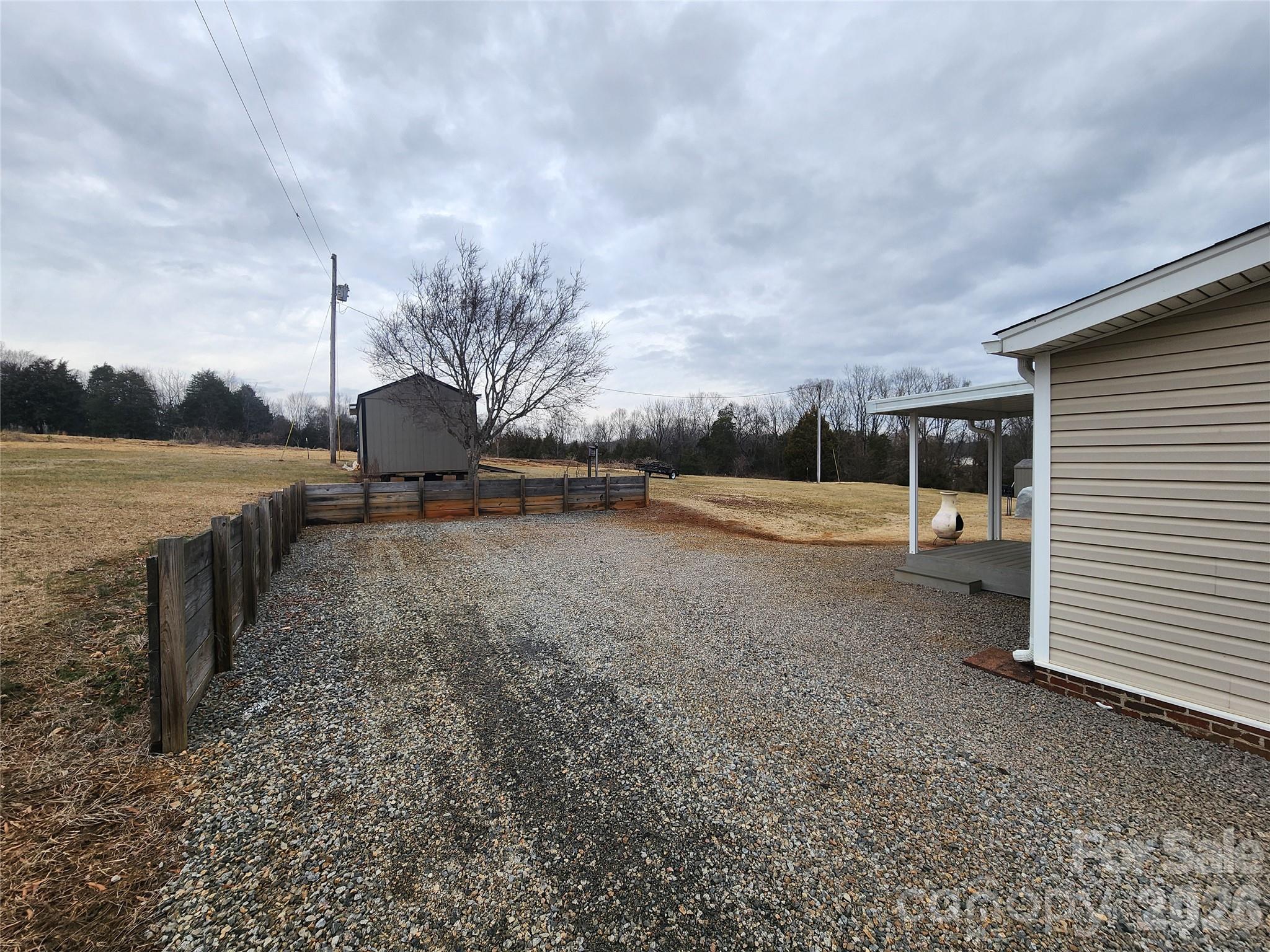 303 Johnson Dairy Road Mooresville, NC 28115 - Photo 7 of 36 a view of a backyard