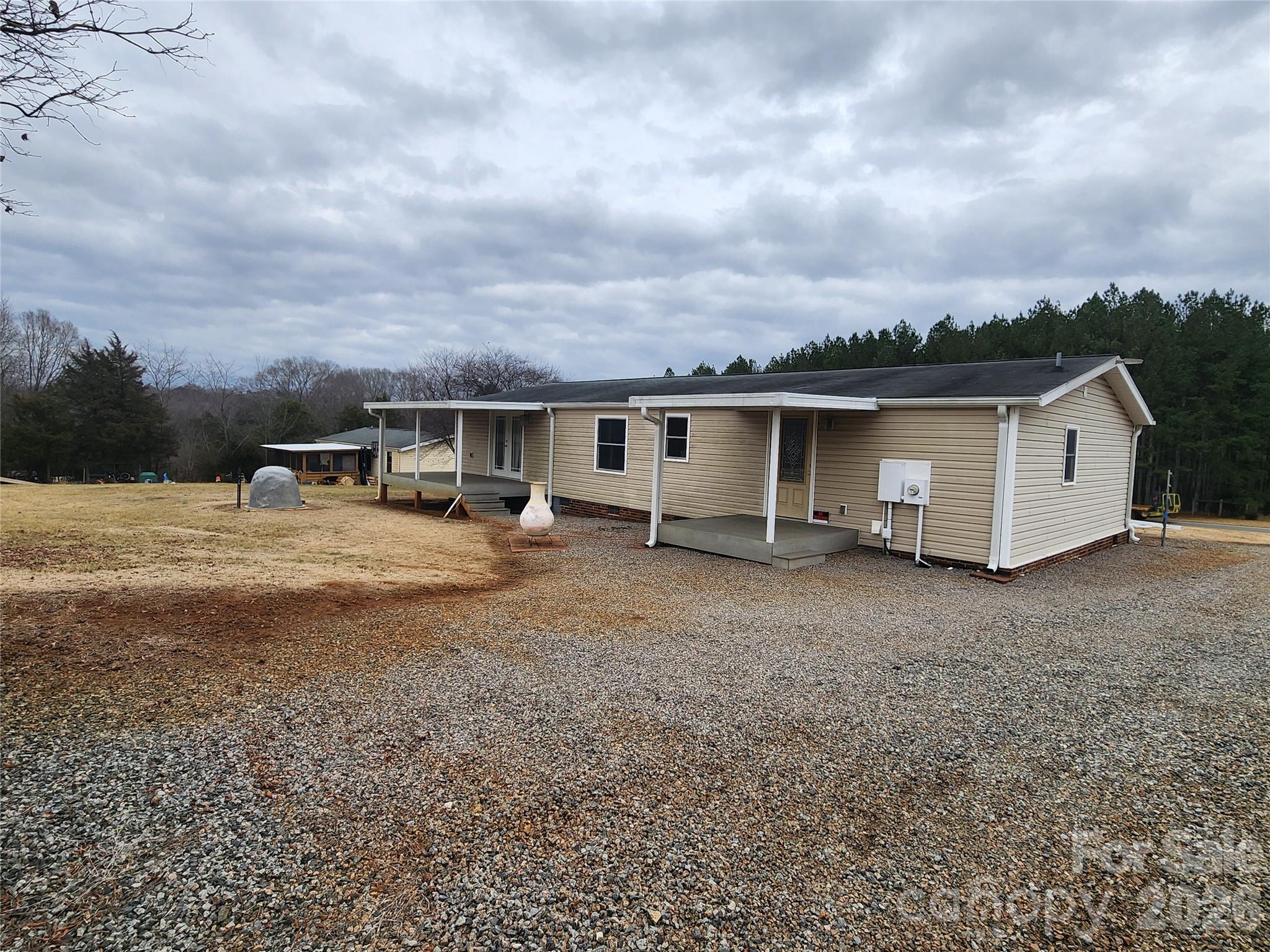 303 Johnson Dairy Road Mooresville, NC 28115 - Photo 10 of 36 a view of a house with backyard