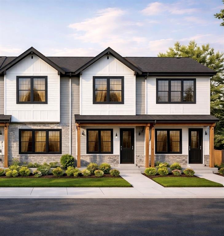Modern inspired farmhouse featuring stone siding, covered porch, and board and batten siding