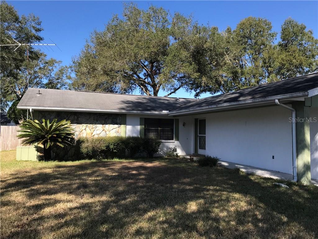 7041 Windmere Road Brooksville, FL 34602 - Photo 1 of 1 a view of a house with a yard