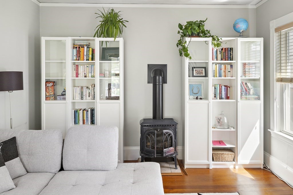 10 Spring Hill Terrace Somerville, MA 02143 - Photo 11 of 20 a living room with furniture and a book shelf