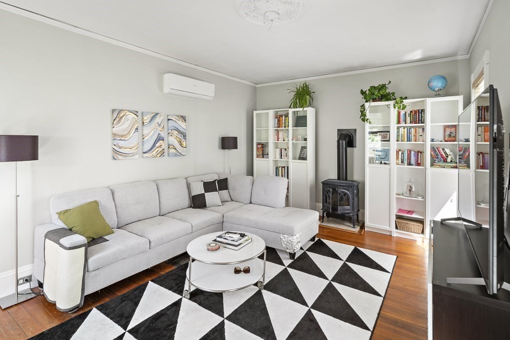 10 Spring Hill Terrace Somerville, MA 02143 - Photo 12 of 20 a living room with furniture a rug and a table