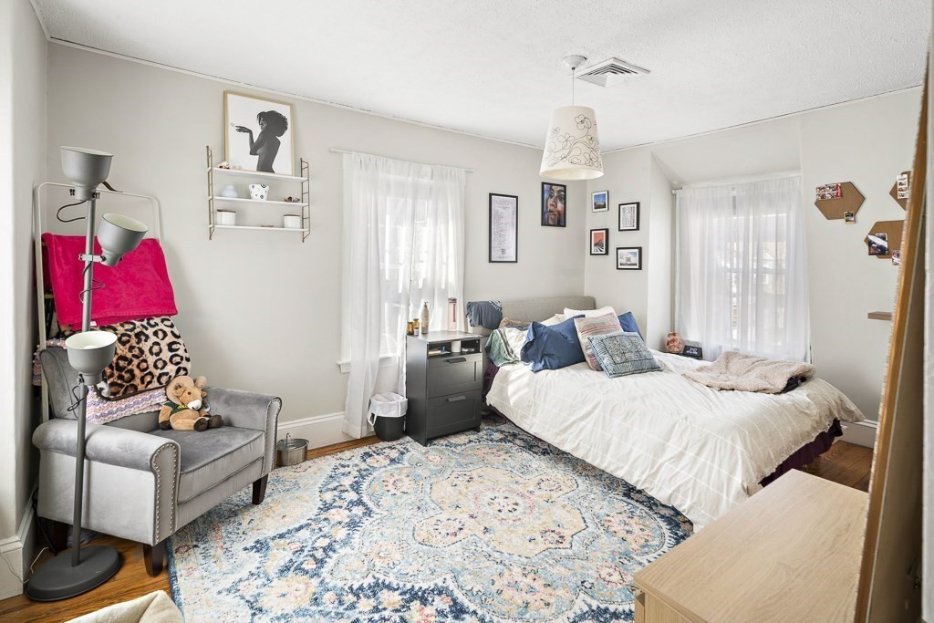 10 Spring Hill Terrace Somerville, MA 02143 - Photo 14 of 20 a bedroom with bed and window
