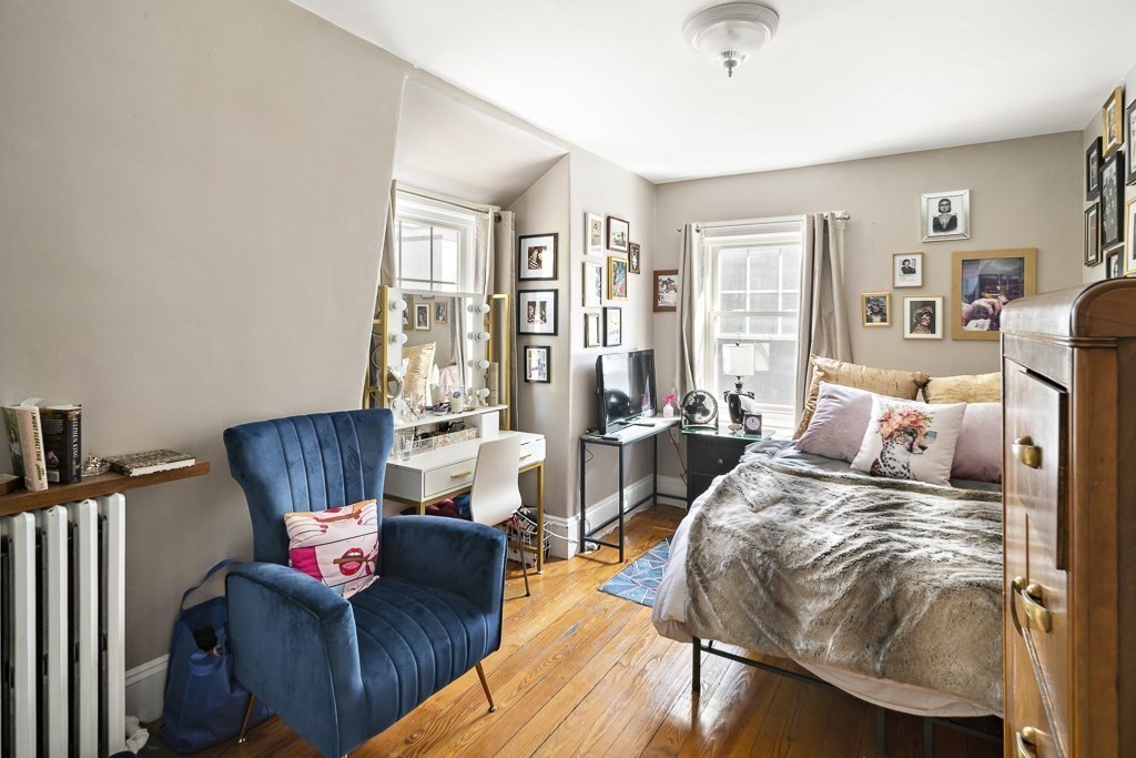 10 Spring Hill Terrace Somerville, MA 02143 - Photo 16 of 20 a living room with furniture and a wooden floor