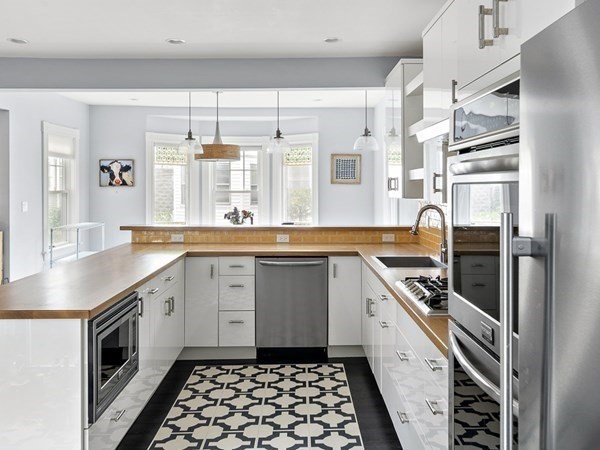 10 Spring Hill Terrace Somerville, MA 02143 - Photo 6 of 20 a kitchen with a sink stove and cabinets