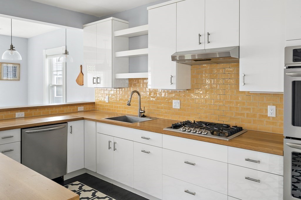 10 Spring Hill Terrace Somerville, MA 02143 - Photo 7 of 20 a kitchen with cabinets and appliances