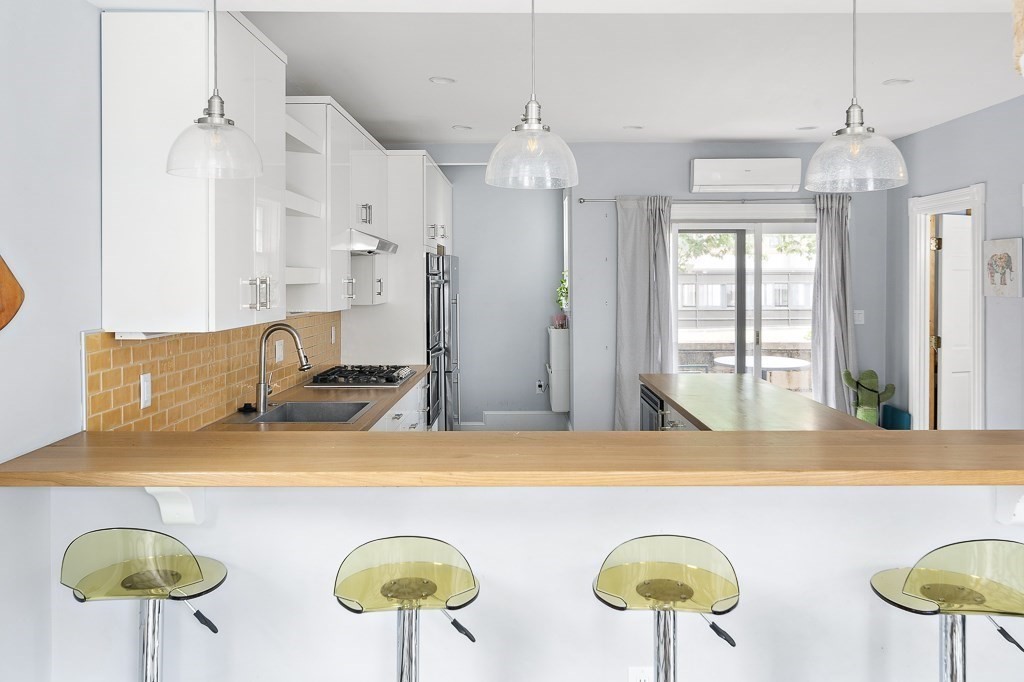 10 Spring Hill Terrace Somerville, MA 02143 - Photo 8 of 20 a view of a dining table chairs in a room