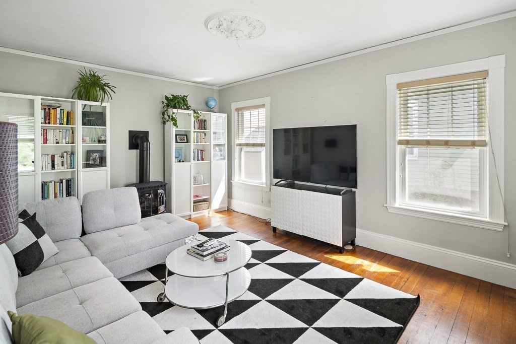 10 Spring Hill Terrace Somerville, MA 02143 - Photo 10 of 20 a living room with furniture and a flat screen tv