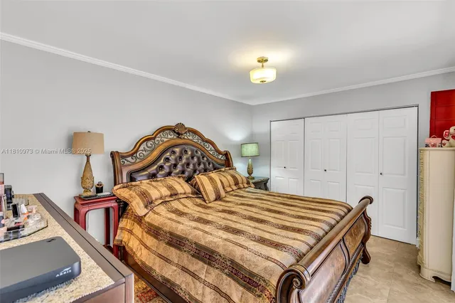 a bedroom with a bed and a table in it