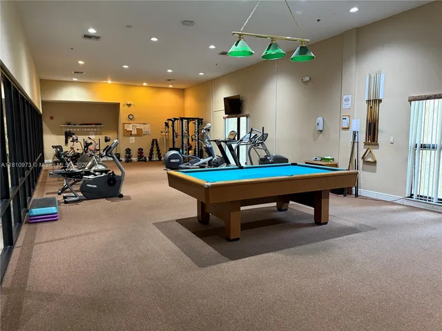 a living room with gym equipment