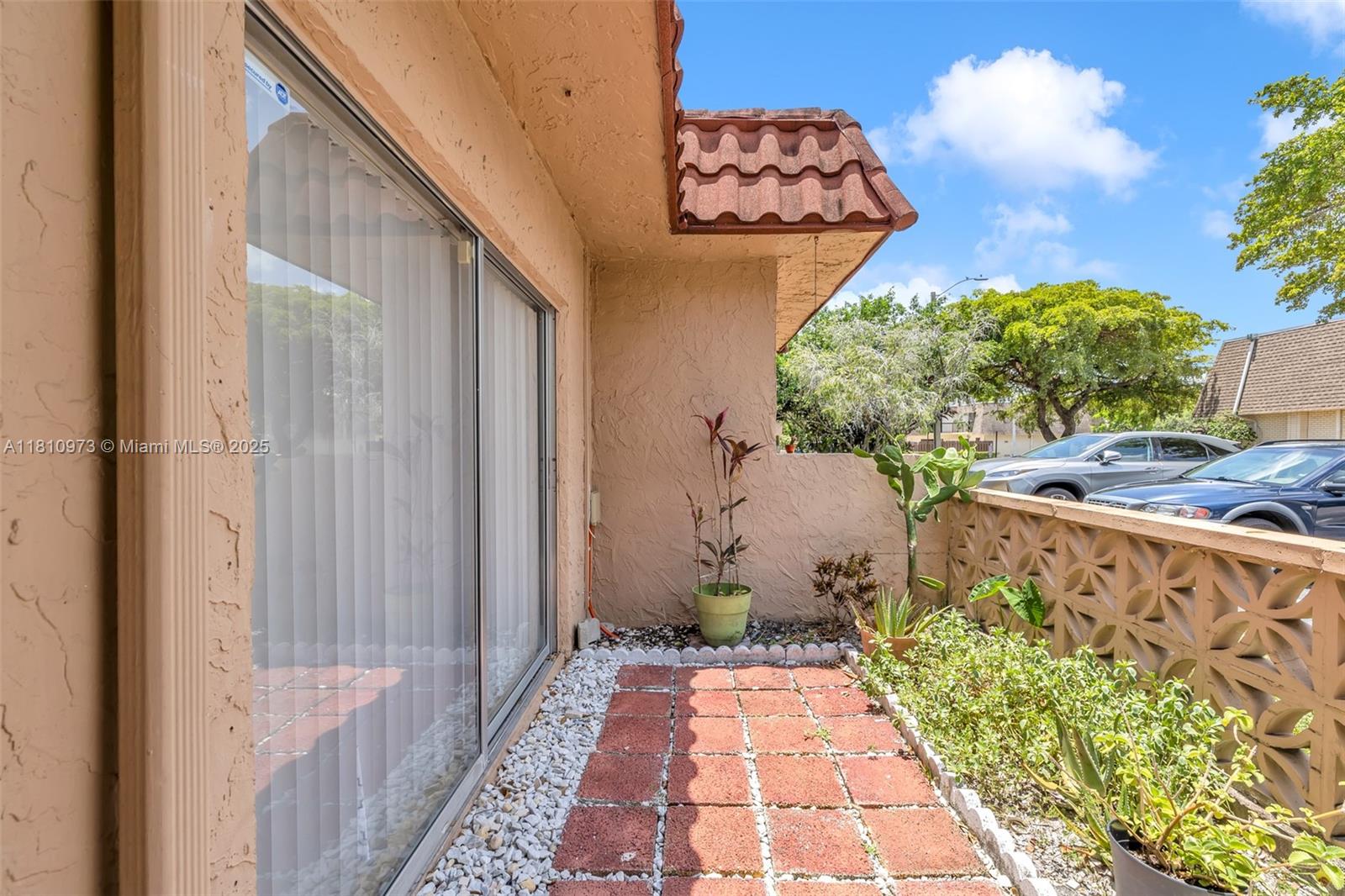 2316 Southwest 81st Way, Unit 8 North Lauderdale, FL 33068 - Photo 8 of 33 a view of entryway with an outdoor space