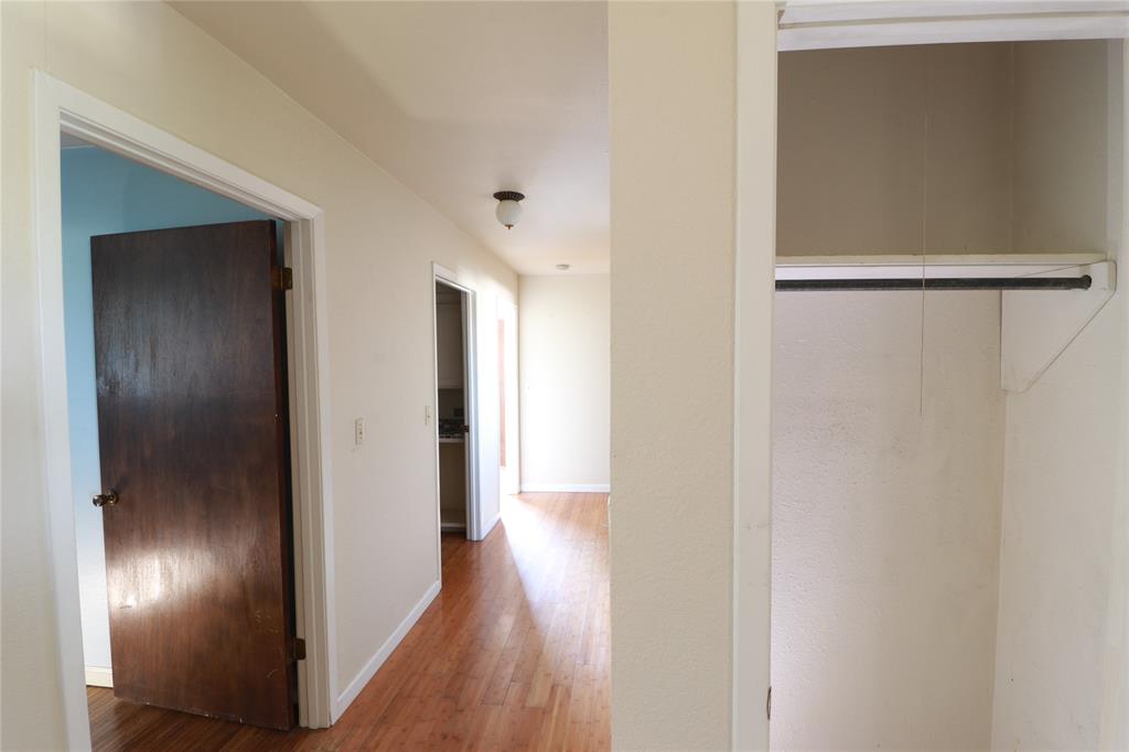 212 Palmer Drive Comanche, TX 76442 - Photo 16 of 40 a view of hallway with wooden floor