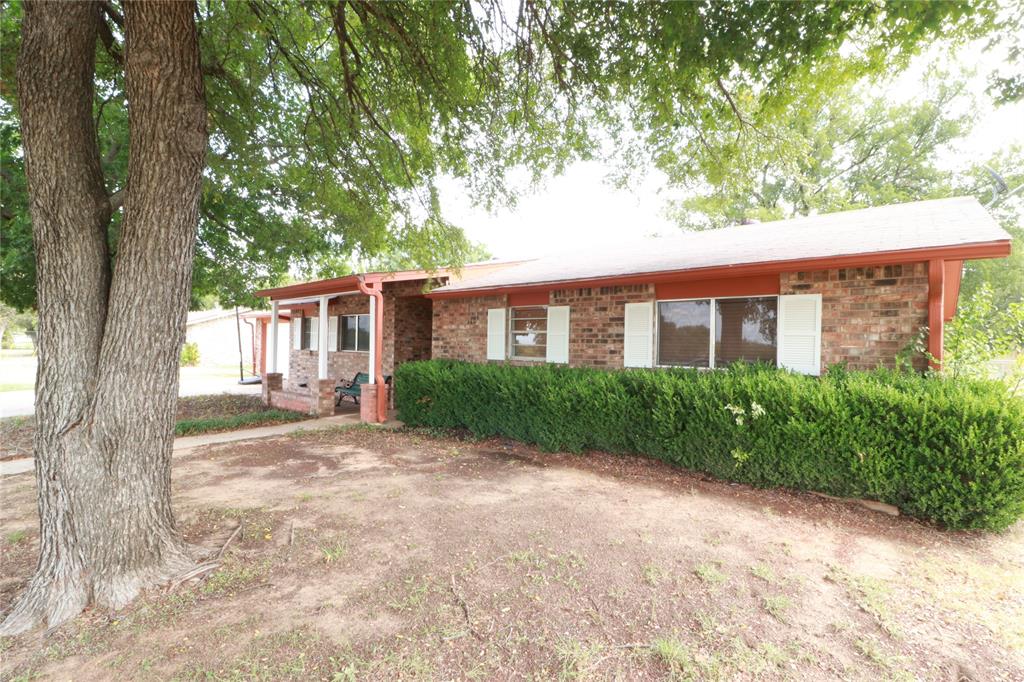 212 Palmer Drive Comanche, TX 76442 - Photo 38 of 40 a view of a house with a tree in front of it