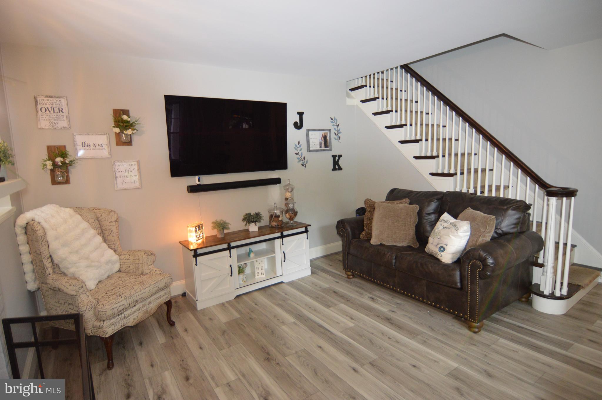 46 Bright Road Hatboro, PA 19040 - Photo 3 of 25 a living room with furniture a flat screen tv and a couch