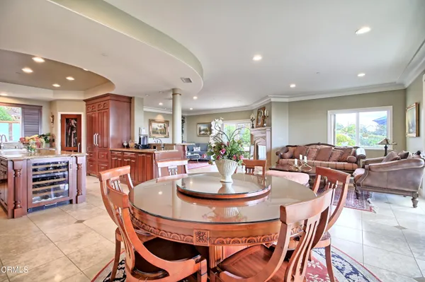 a view of a dining room with furniture window and outside view
