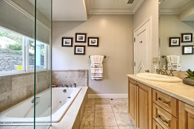 a bathroom with a washing machine and a sink