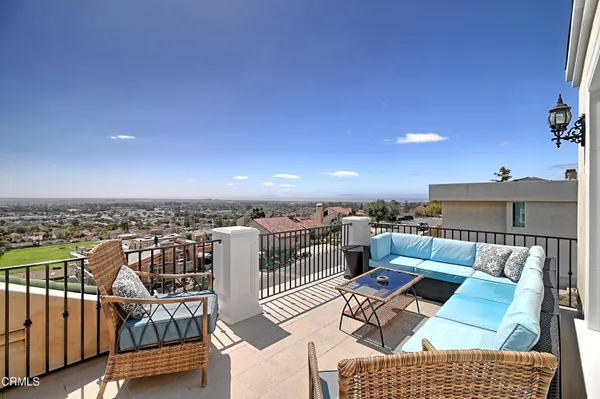a view of balcony with furniture