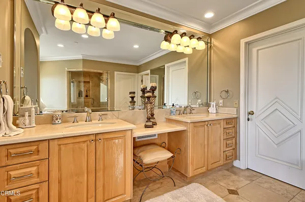 a spacious bedroom with a bed and a large window