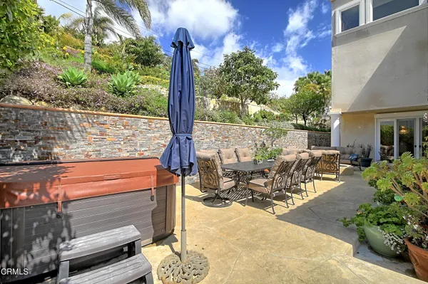 a view of a balcony with couches and wooden floor