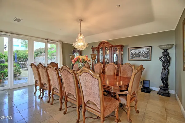 a large kitchen with stainless steel appliances and large cabinets