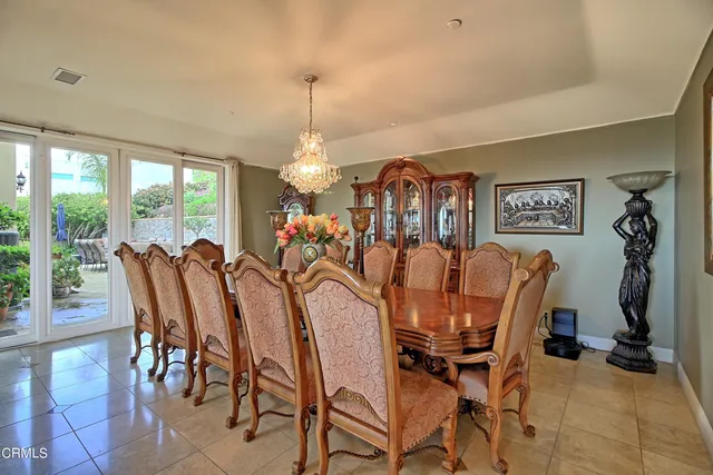 a large kitchen with stainless steel appliances and large cabinets