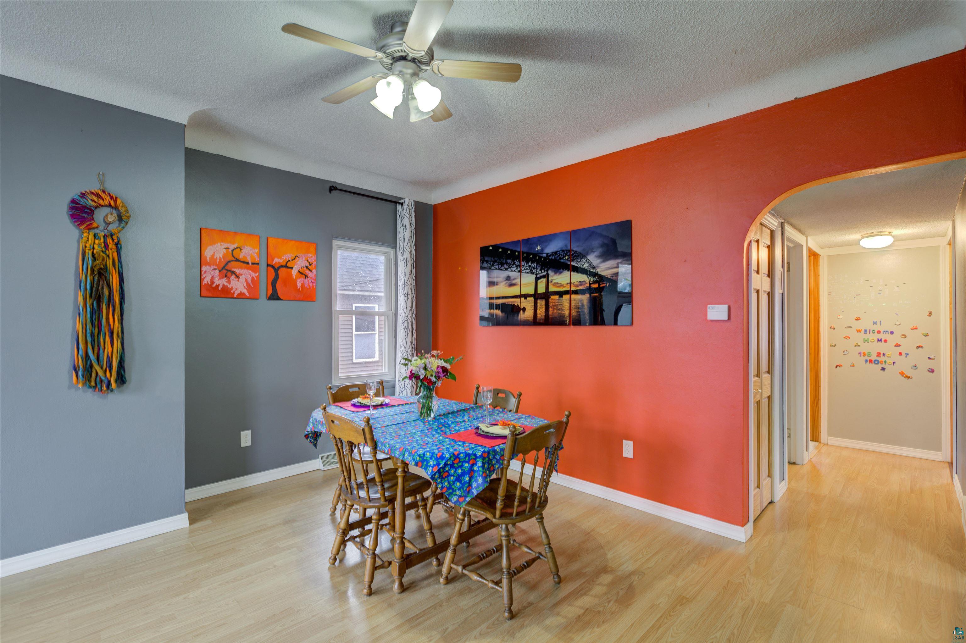 136 2nd Street Proctor, MN 55810 - Photo 6 of 21 The flow from the living room to dining room is seamless.