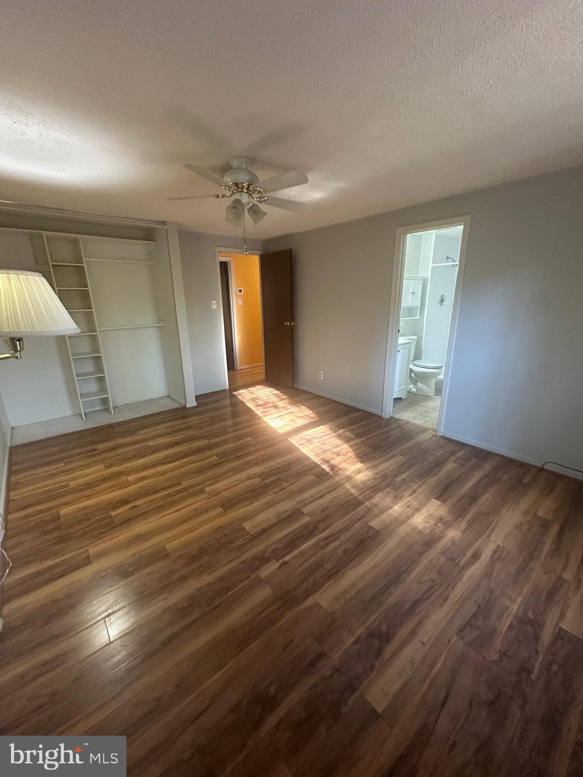 12 Adams Court Marlton, NJ 08053 - Photo 14 of 15 a view of an empty room with window and wooden floor